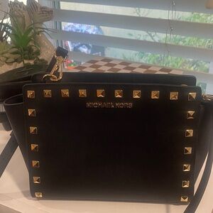 Michael Kors Pre loved condition Black & Gold purse.